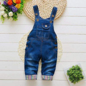 Macacão Jardineira Jeans  c/ Aplicações Pompom Bebê Menina | 9 Meses - 4 Anos