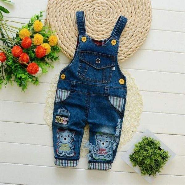 Macacão Jardineira Jeans  c/ Aplicações Pompom Bebê Menina | 9 Meses - 4 Anos