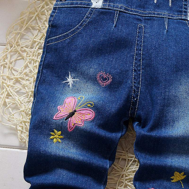 Macacão Jardineira Jeans  c/ Aplicações Pompom Bebê Menina | 9 Meses - 4 Anos